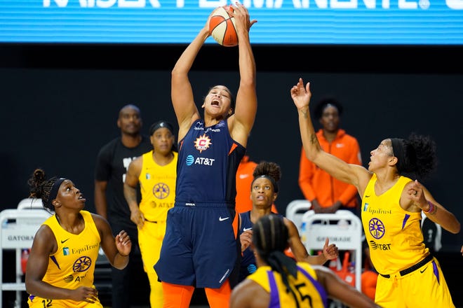Second round: Connecticut Sun center Brionna Jones (42) pulls down a rebound against the Los Angeles Sparks during their single-elimination game on Sept. 17. The Sun won 73-59 to advance to the semifinals.