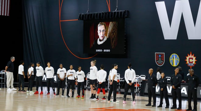 Semifinals: Las Vegas Aces players stand for a tribute to late Supreme Court justice Ruth Bader Ginsburg before Game 1 of their best-of-five series against the Connecticut Sun on Sept. 20.