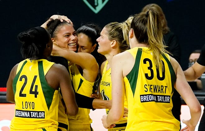 Semifinals: The Seattle Storm's Alysha Clark celebrates with teammates after scoring the game-winning basket in an 88-86 win in Game 1 over the Minnesota Lynx.