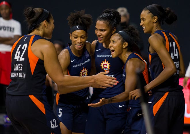 Semifinals: Connecticut Sun players celebrate during their 77-68 Game 3 win over the Las Vegas Aces. The Sun lead the best-of-five series 2-1.