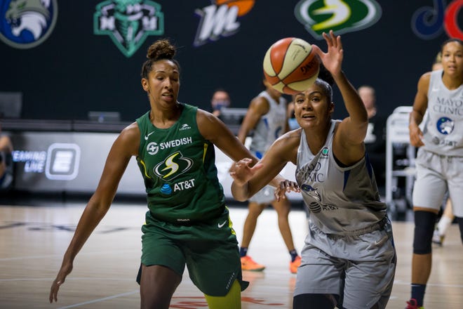 Semfinals: Minnesota Lynx forward Damiris Dantas, right, chases after a loose ball against the Seattle Storm center Mercedes Russell, left, during Game 2 of their best-of-five series on Sept. 24.