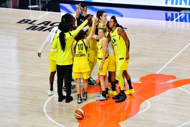 Semifinals: The Seattle Storm celebrate after defeating the Minnesota Lynx 92-71 in Game on Sept. 27 to advance to the WNBA Finals.