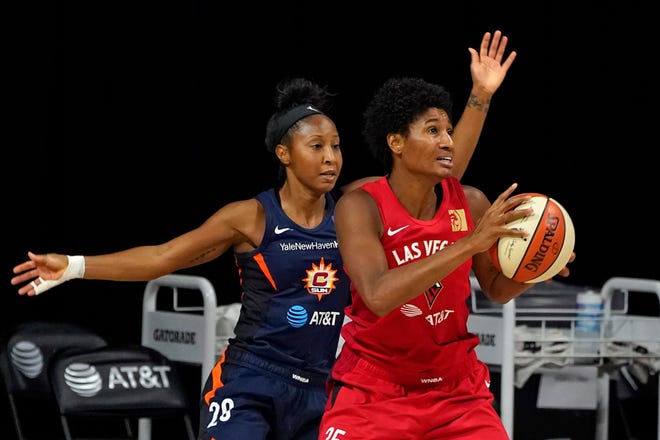 Semifinals: Las Vegas Aces forward Angel McCoughtry, right, working against Connecticut Sun guard Briann January, tallied 29 points, six assists, five rebounds and three steals in Game 4.