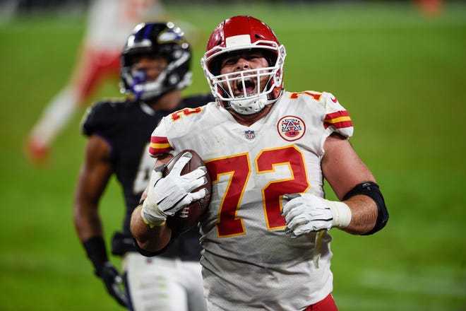 Kansas City Chiefs offensive tackle Eric Fisher (72) celebrates his touchdown catch during the second half of an NFL football game against the Baltimore Ravens, Monday, Sept. 28, 2020, in Baltimore.