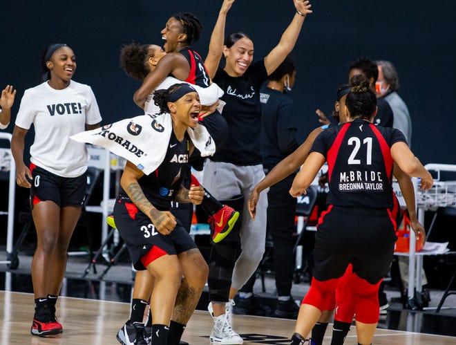 Semifinals: The Aces celebrate after defeating the Sun in Game 5 to advance to the WNBA Finals.