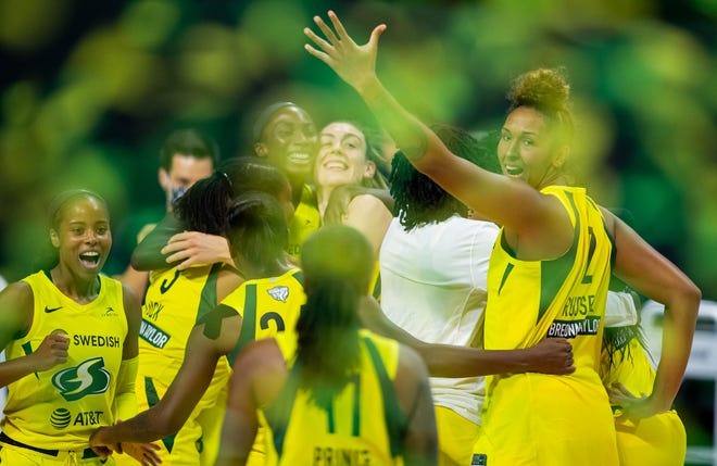 Finals: Members of the Seattle Storm celebrate after winning the 2020 WNBA Finals with a 92-59 Game 3 win over the Las Vegas Aces at IMG Academy.