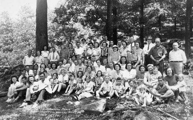 Employees of the Black Mountain Hosiery Mill pose at their first annual picnic at Mill Creek, 1941.